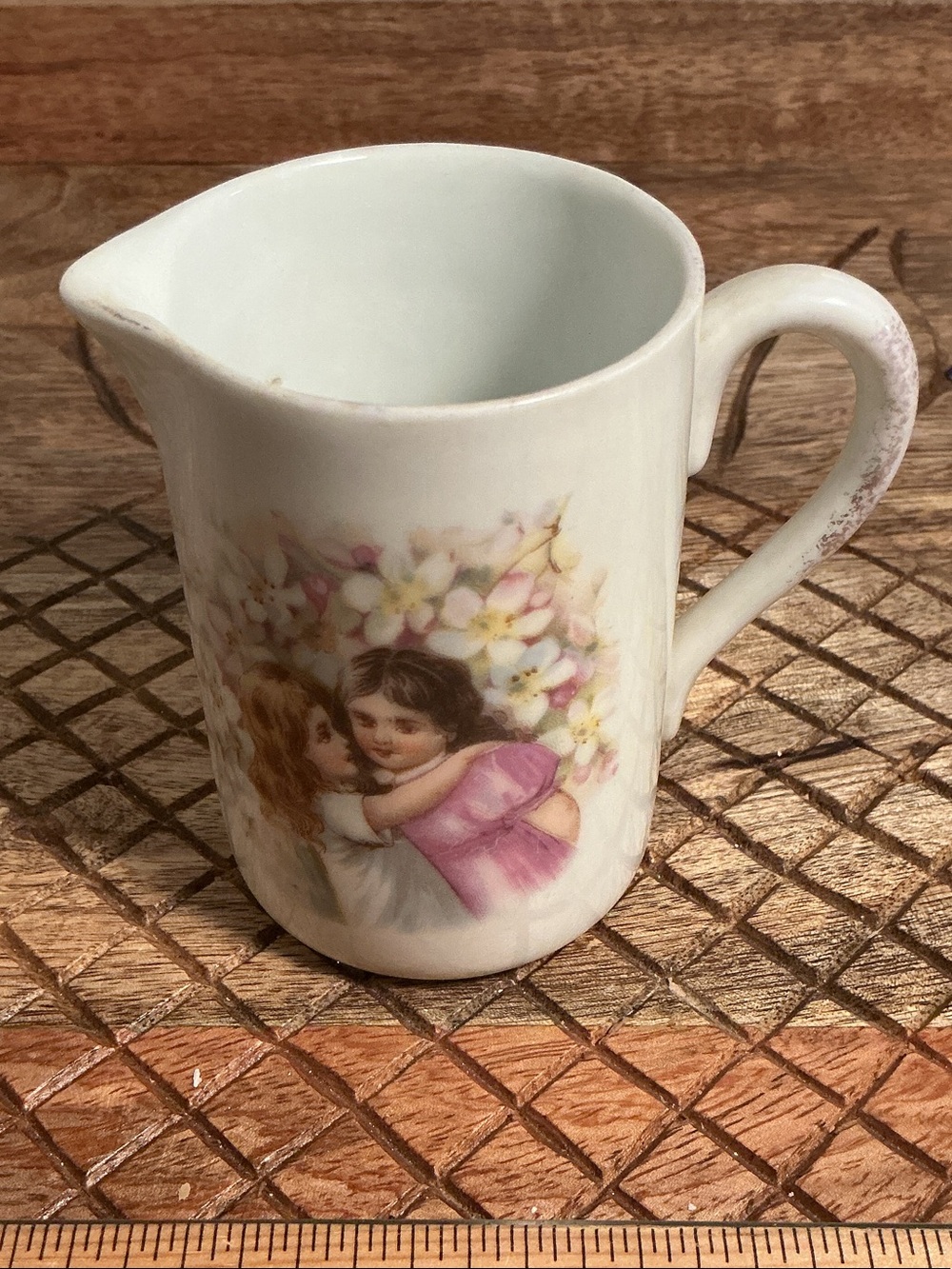 Antique White Porcelain Creamer with Floral and Children Motif